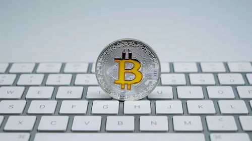 Bitcoin symbol against a backdrop of renewable energy wind turbines